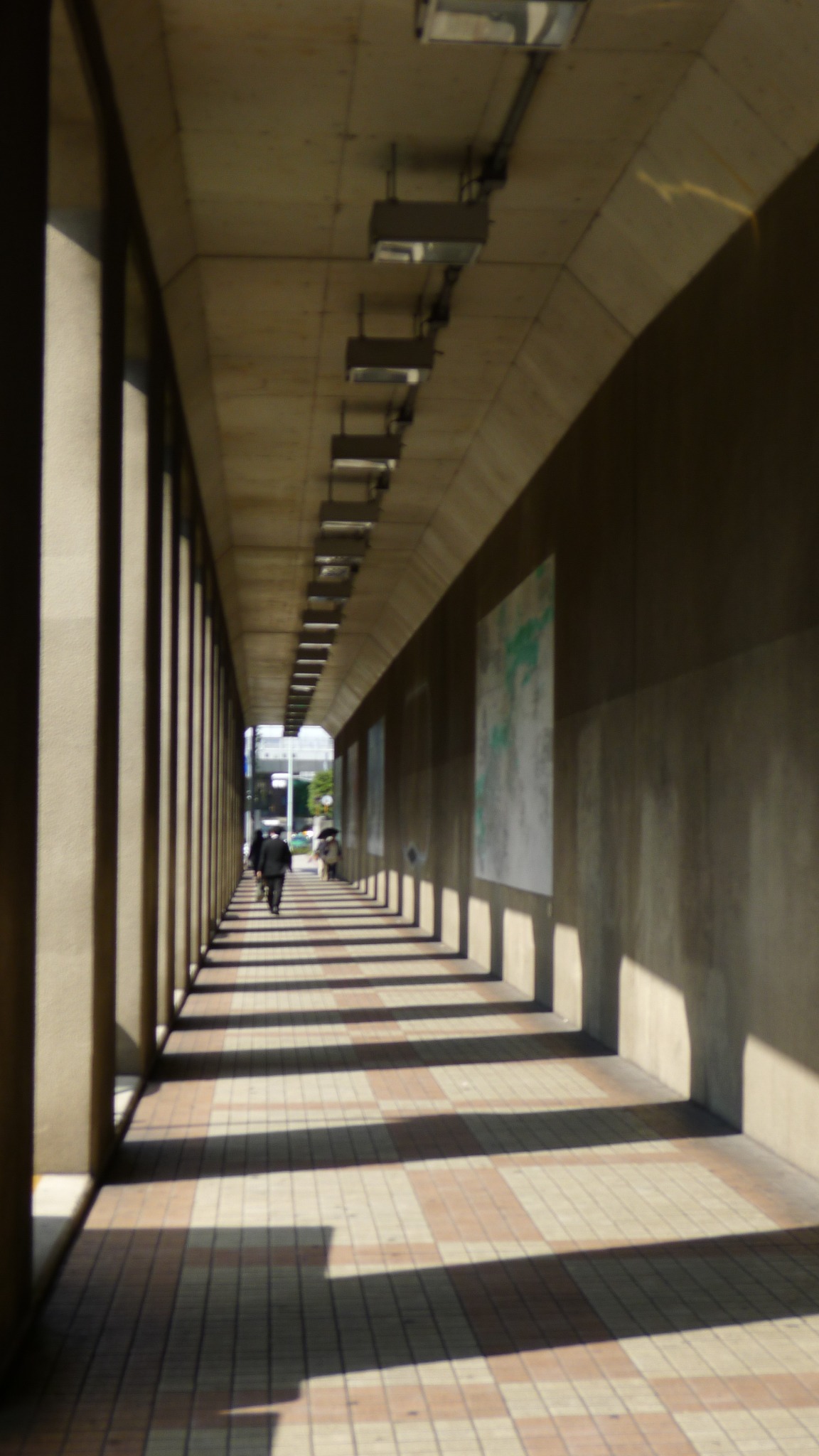 A long corridor patterned with light and shadow, photographed by Ching-Yi Lai